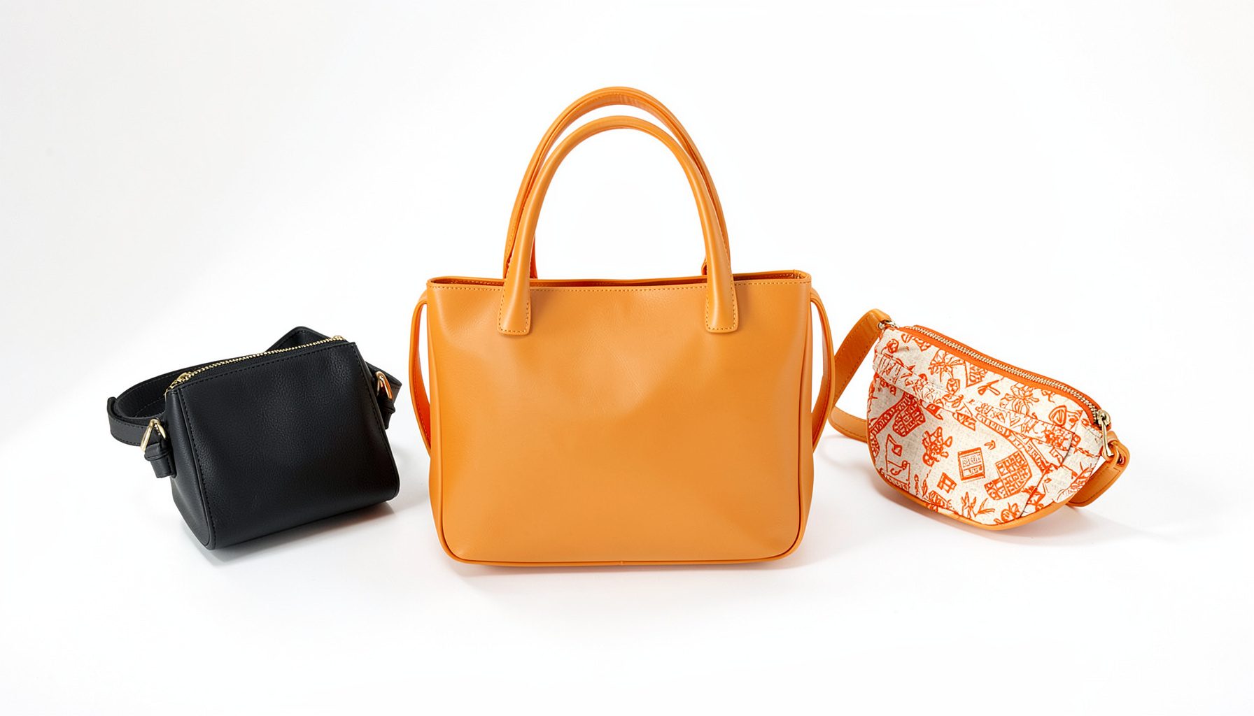 Three stylish handbags arranged on a neutral surface: a compact black crossbody, a mid-sized tan leather tote, and a small patterned fanny pack, with soft natural light casting gentle shadows.